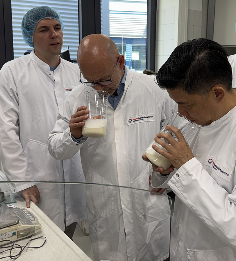Sternchemie technologists analysing lecithin Three Sternchemie technologists analysing the odour of lecithin in labatory.