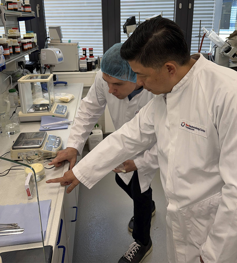 Sternchemie technologists in labatory Two Sternchemie technologists analysing lecithin in labatory.